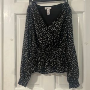 Pretty black print lined top. Junior size XS. Like new. Worn once.